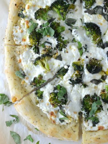 overhead shot of four cheese white broccoli pizza