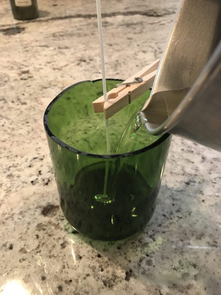 pouring wax in glass for soy candles