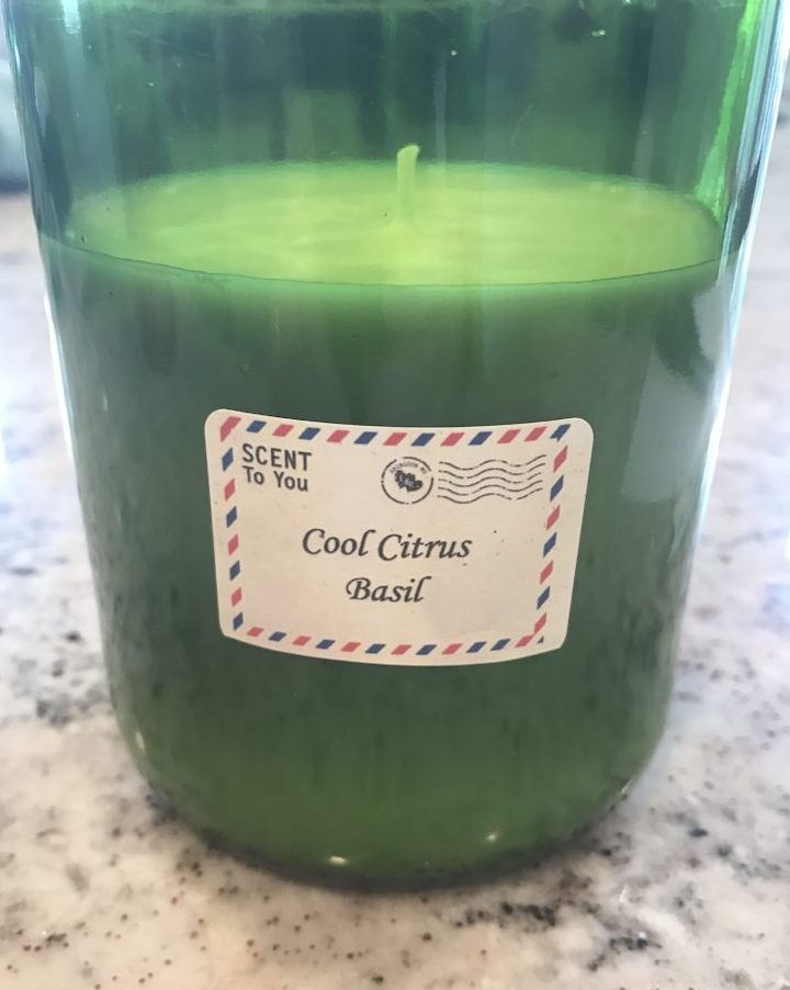 close-up of Homemade Soy Candle in cut wine bottle