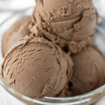 4 scoops of dark chocolate gelato in glass bowl
