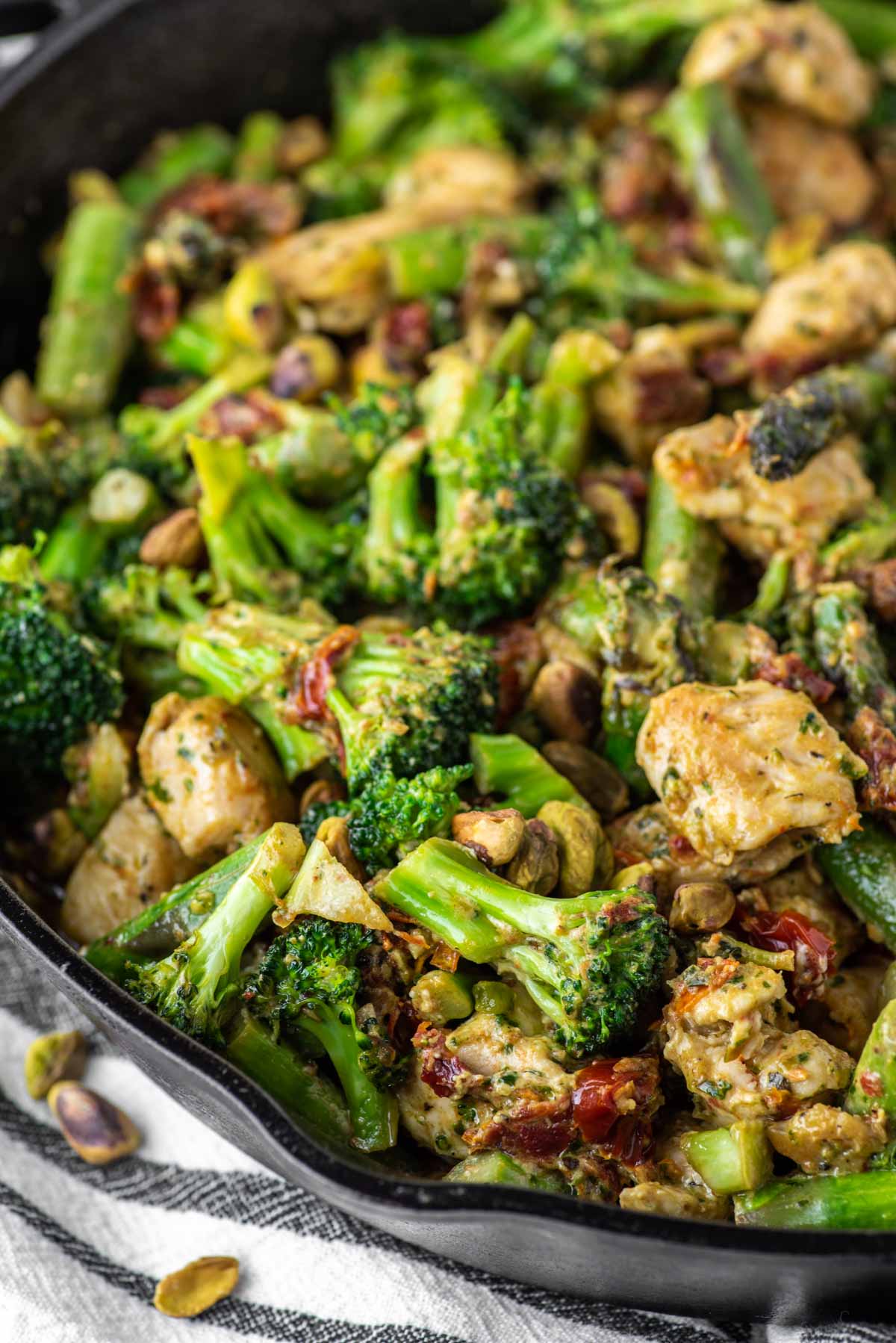 one pan pesto chicken and veggies in cast iron skillet