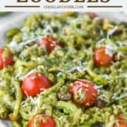 zoodles with pesto and tomatoes on plate