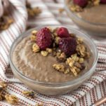 chocolate chia seed pudding in glass bowl on dish towel