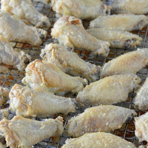 close-up of easy crispy baked chicken wings on baking sheet