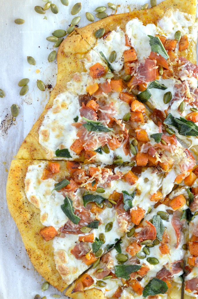 overlay of roasted butternut squash apple pizza on parchment paper