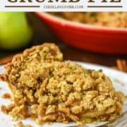 slice of apple crumb pie on white plate with fork