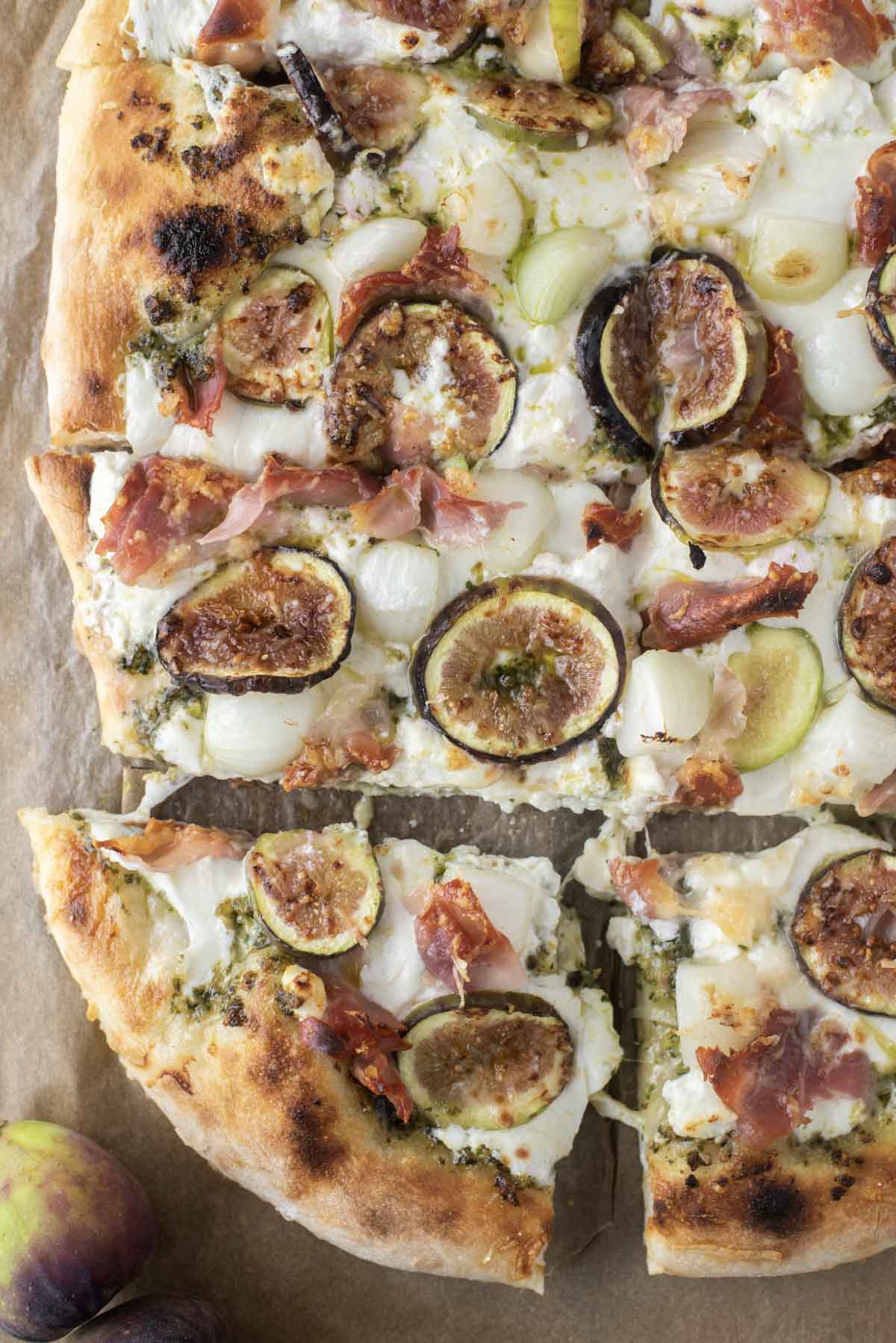 overhead shot of fig pizza on parchment paper