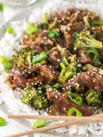 beef and broccoli made in slow cooker on plate with chopsticks