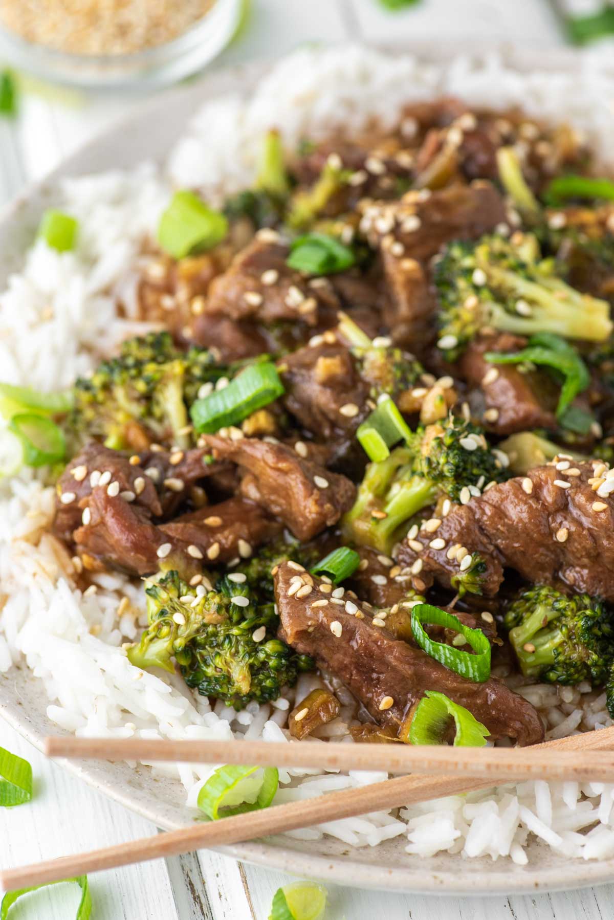 beef and broccoli made in slow cooker on plate with chopsticks