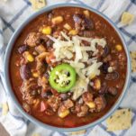 overhead shot of beef chili in blue bowl