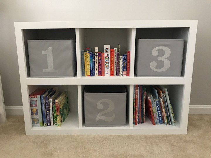 white 6 cube bookshelf with books