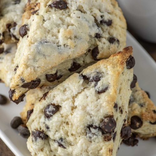 chocolate chip scones stacked on white plate