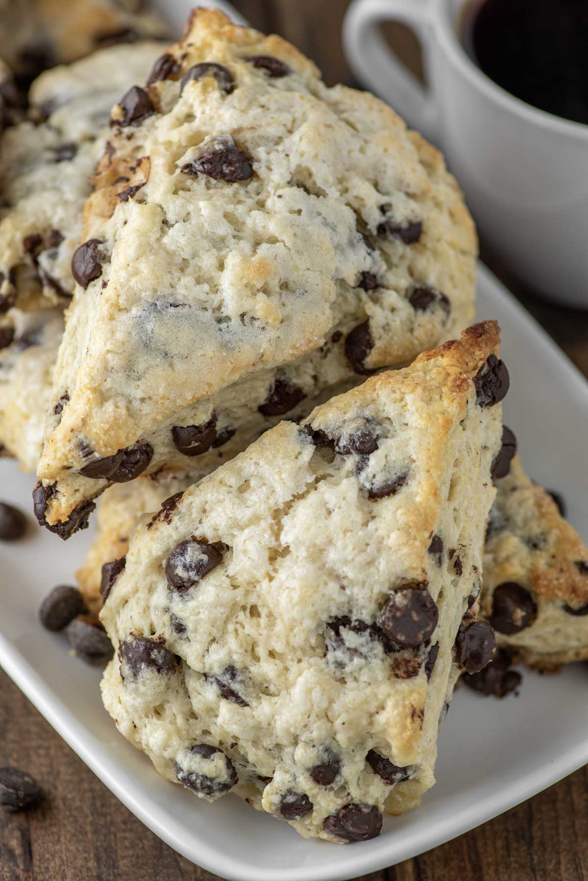 chocolate chip scones stacked on white plate