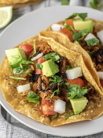 slow cooker chicken tacos on plate