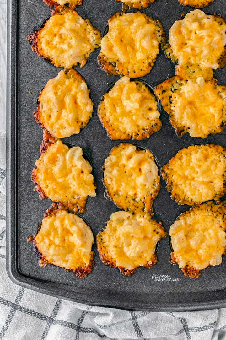 overhead shot of baked mac and cheese bites in mini muffin tin