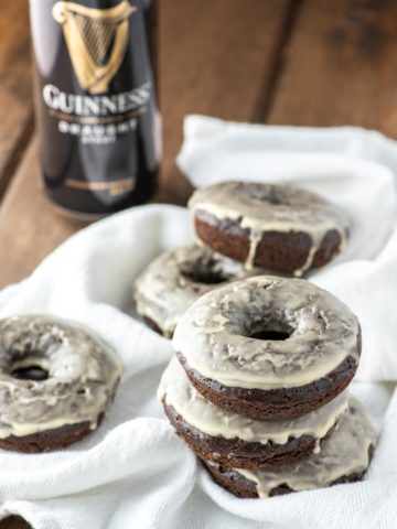 close-up of Guinness chocolate donuts stacked on white kitchen towel
