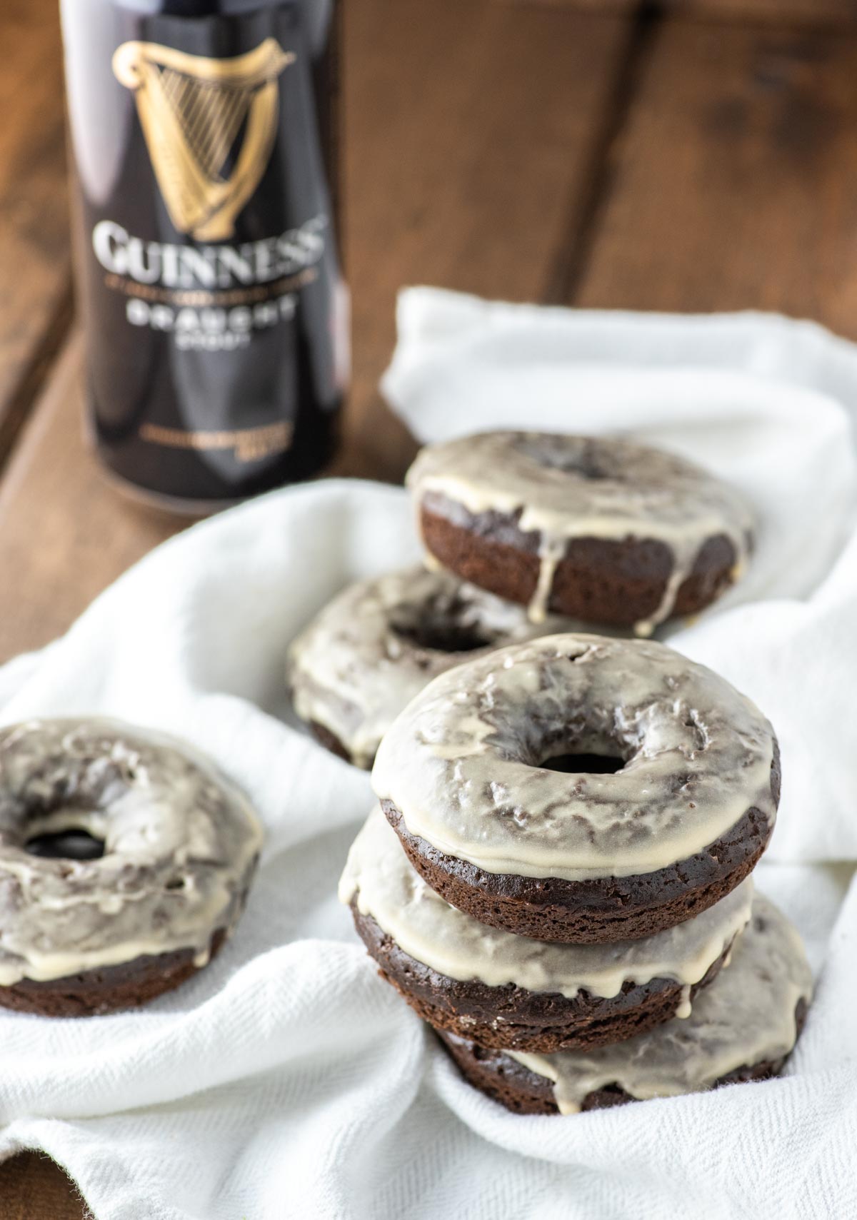 close-up of Guinness chocolate donuts stacked on white kitchen towel