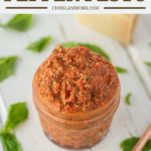 roasted red pepper pesto in glass jar with spoon