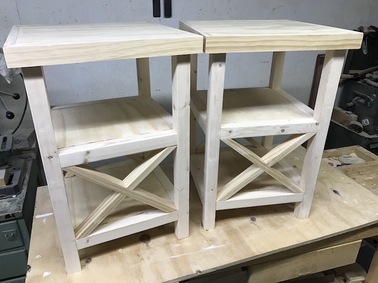 two finished x end tables