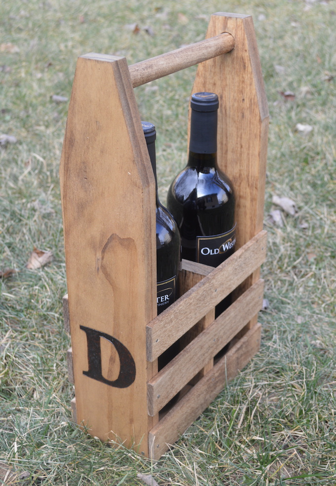 wine caddy with two bottles of wine on grass