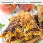 stacked BBQ chicken and peach quesadillas on wood board
