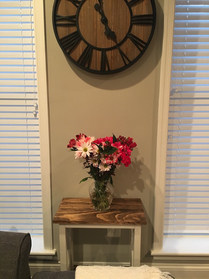 X Side Table with flowers on top