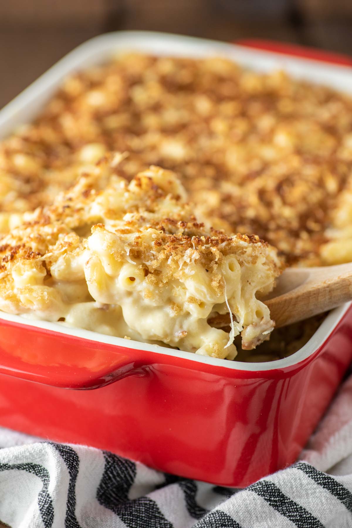 baked gouda mac and cheese in oval green baking dish