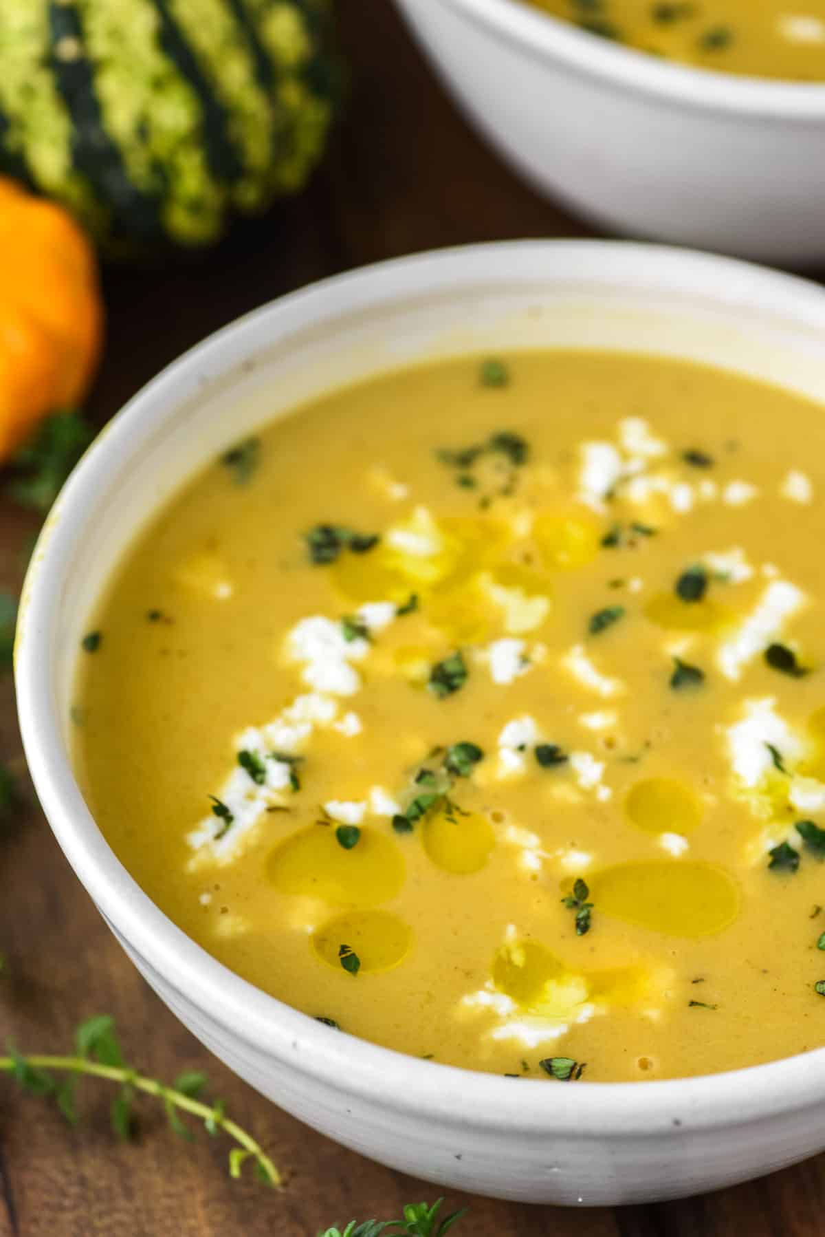 soup with butternut squash and sweet potatoes in speckled bowl