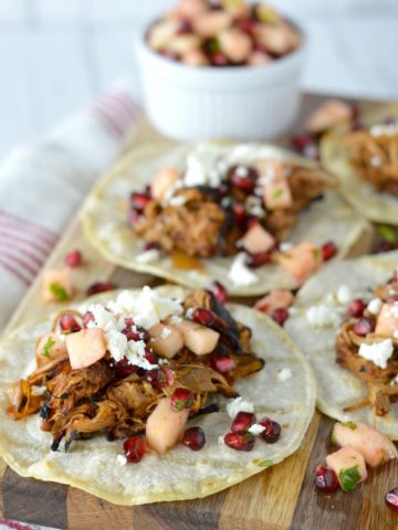 close-up of cider beer braised pork tacos on cutting board