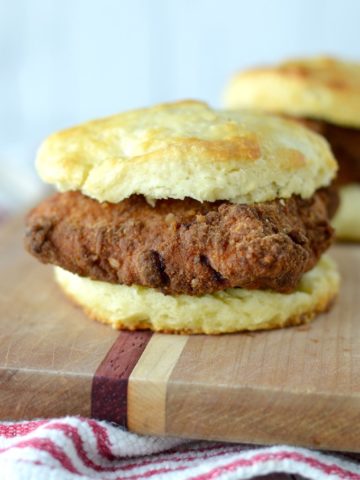 close-up of copycat Chick-fil-A chicken biscuit on wood cutting board