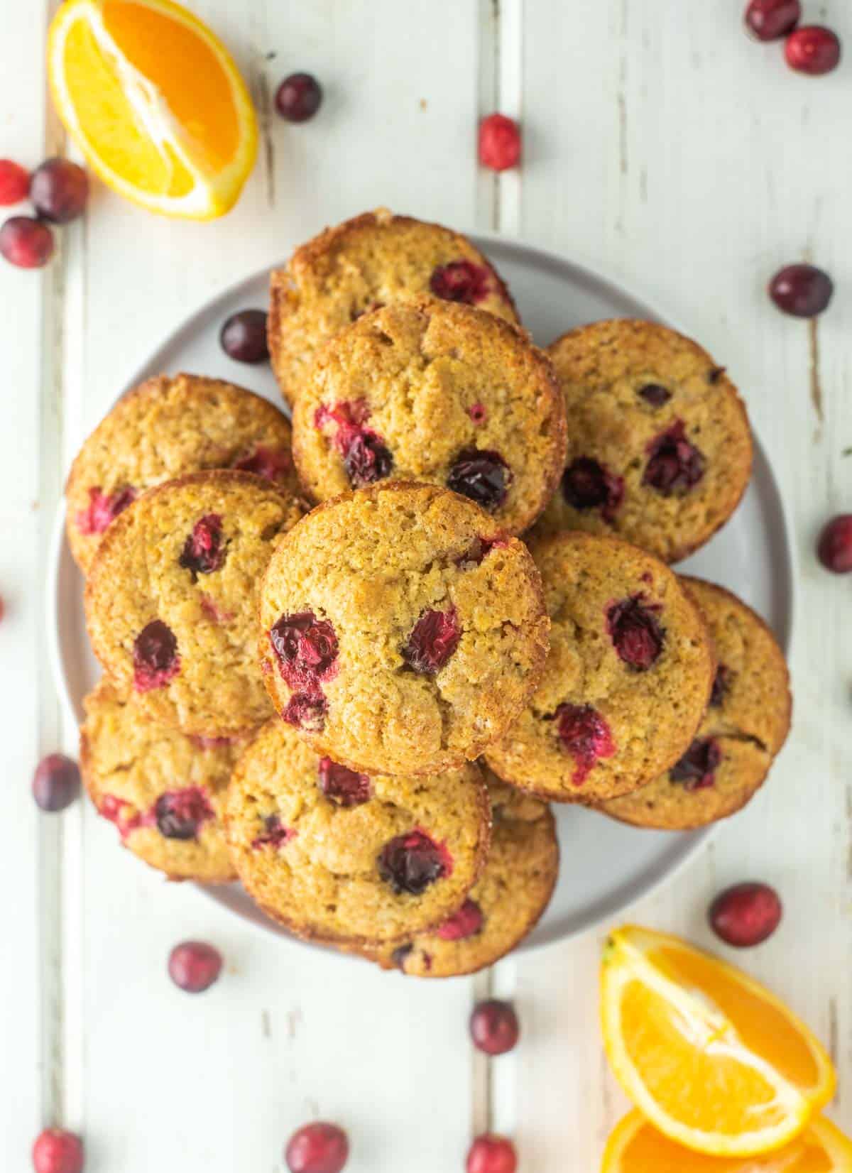 overhead shot of cranberry orange muffins on white plate
