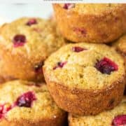 stack of cranberry orange muffins on white plate