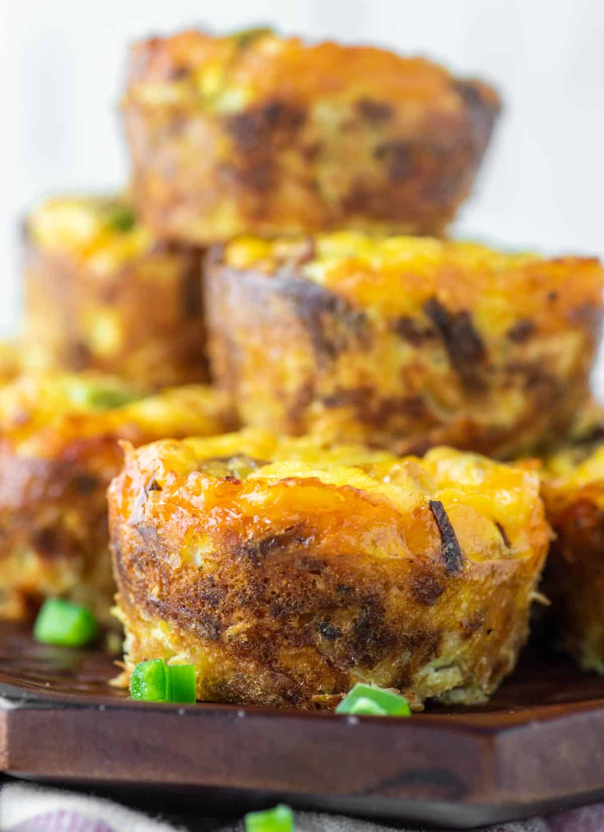 hash brown egg muffins stacked on board