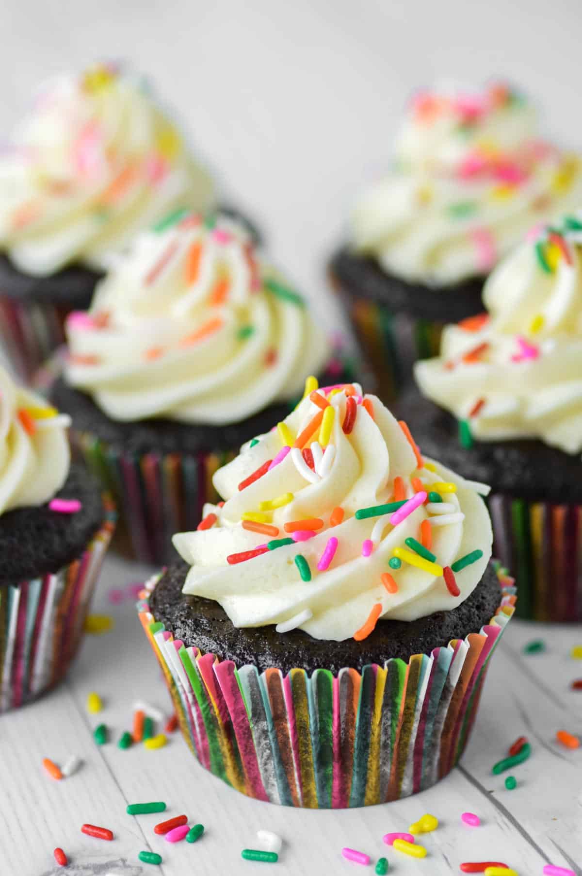 close-up of chocolate cupcakes with vanilla frosting