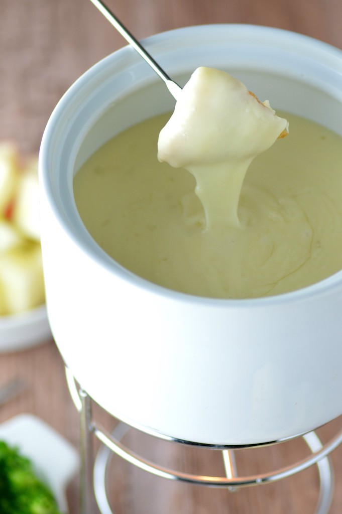bread dipping in cheese fondue