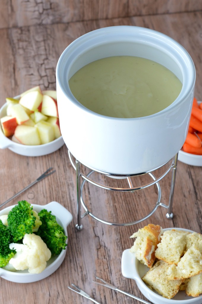 fondue in white pot with dippers
