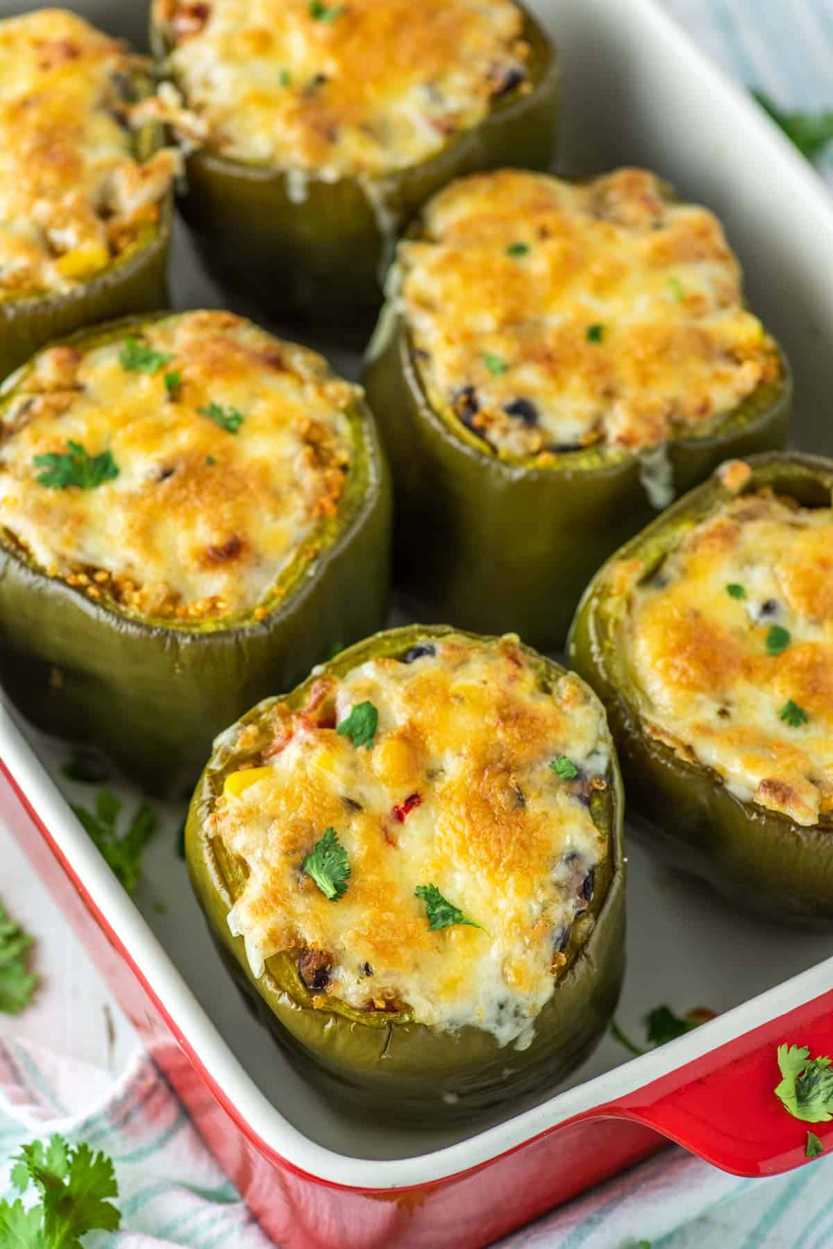 peppers stuffed with quinoa in baking dish