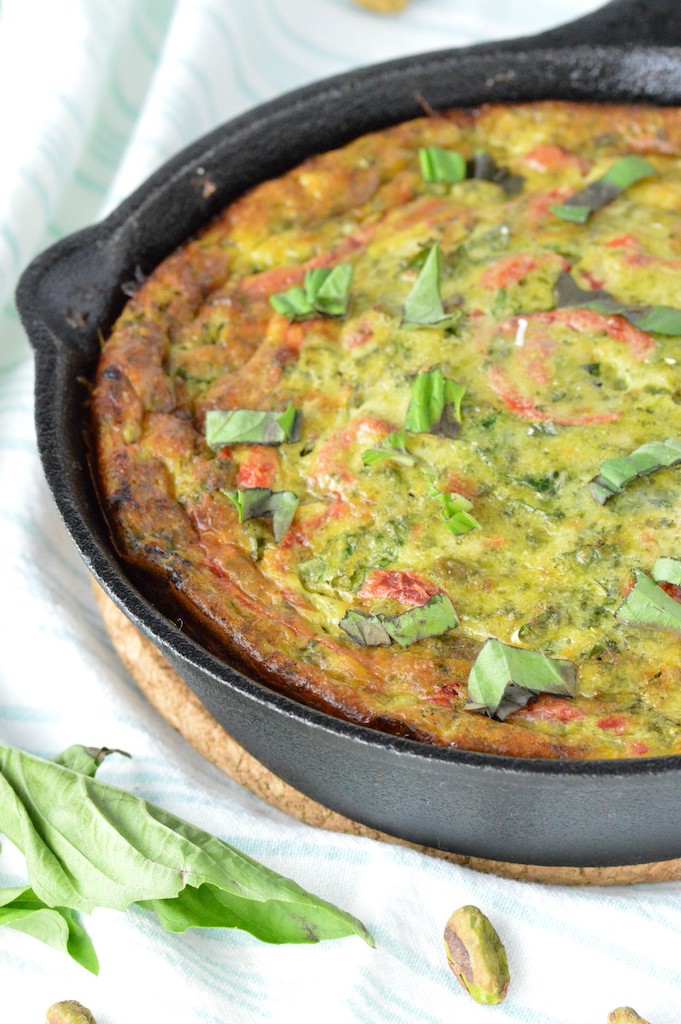 close-up of roasted red pepper frittata in cast iron skillet