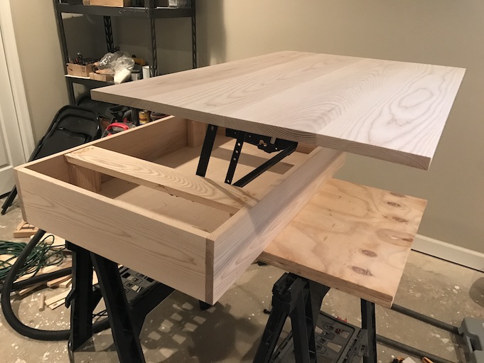 installing lift top mechanism to top of table