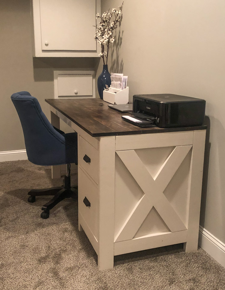 side view of farmhouse desk in office with blue chair