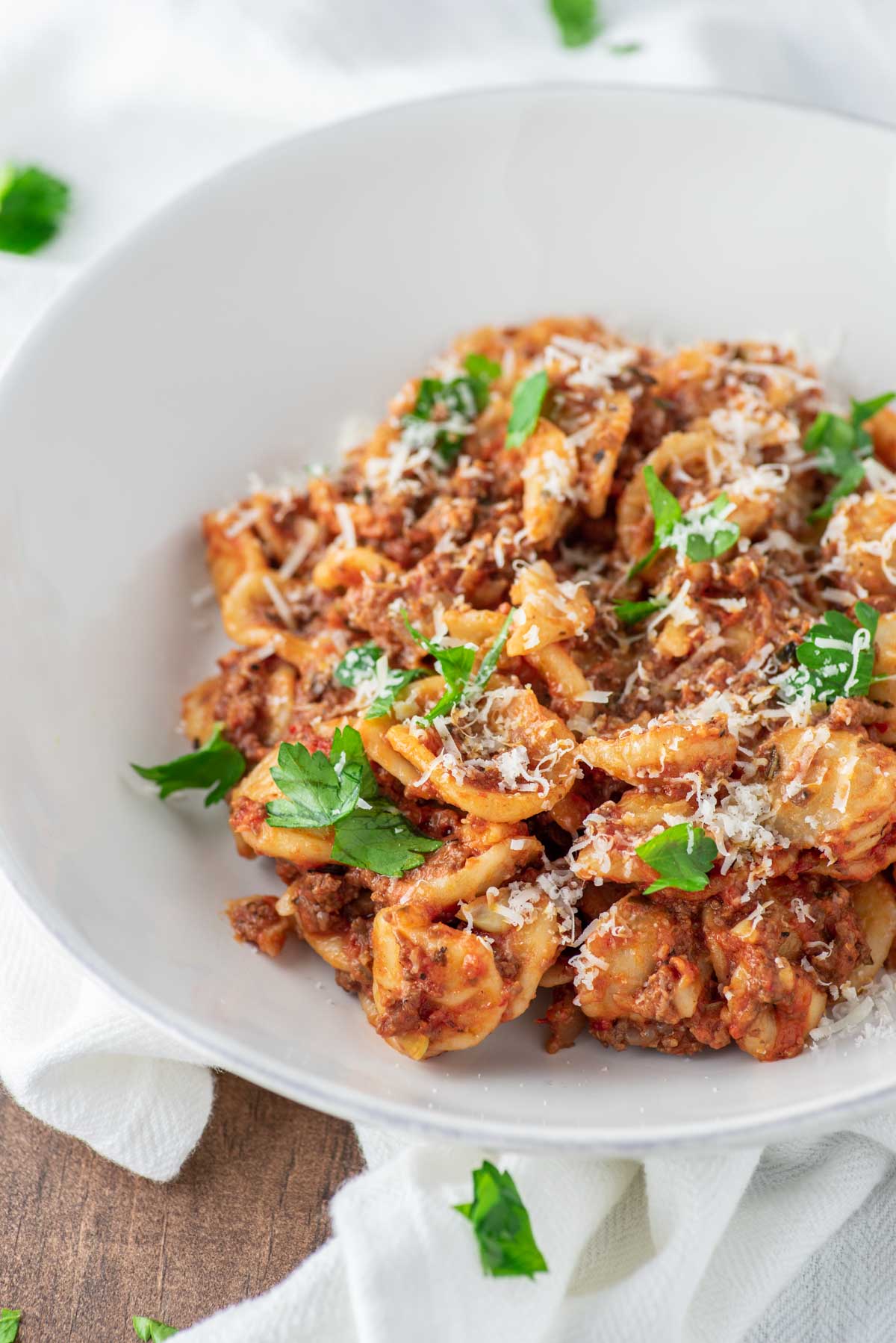 close-up of weeknight bolognese in white bowl