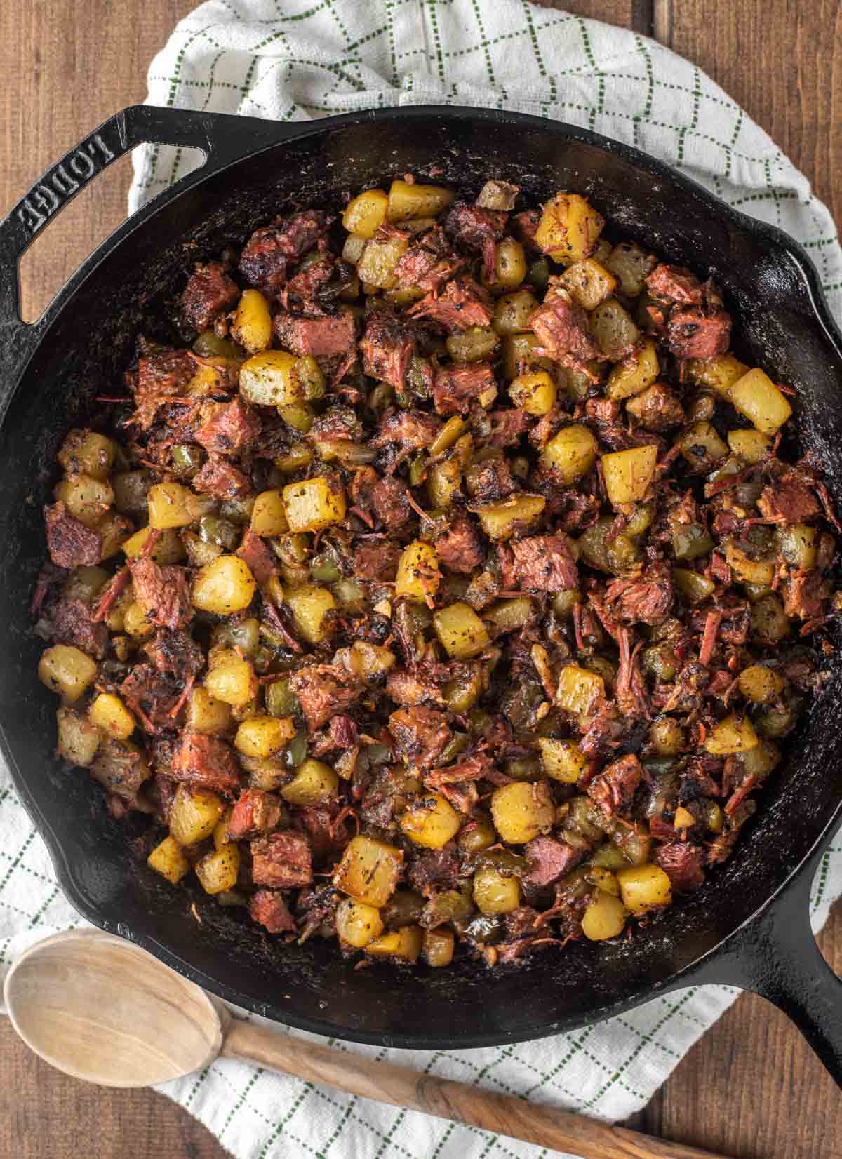 overhead shot of cast iron skillet with corned beef hash