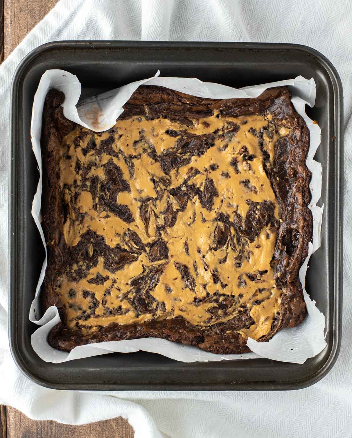 overhead shot of vegan gluten-free peanut butter swirl brownies in square pan