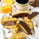 orange pistachio biscotti with cup of coffee