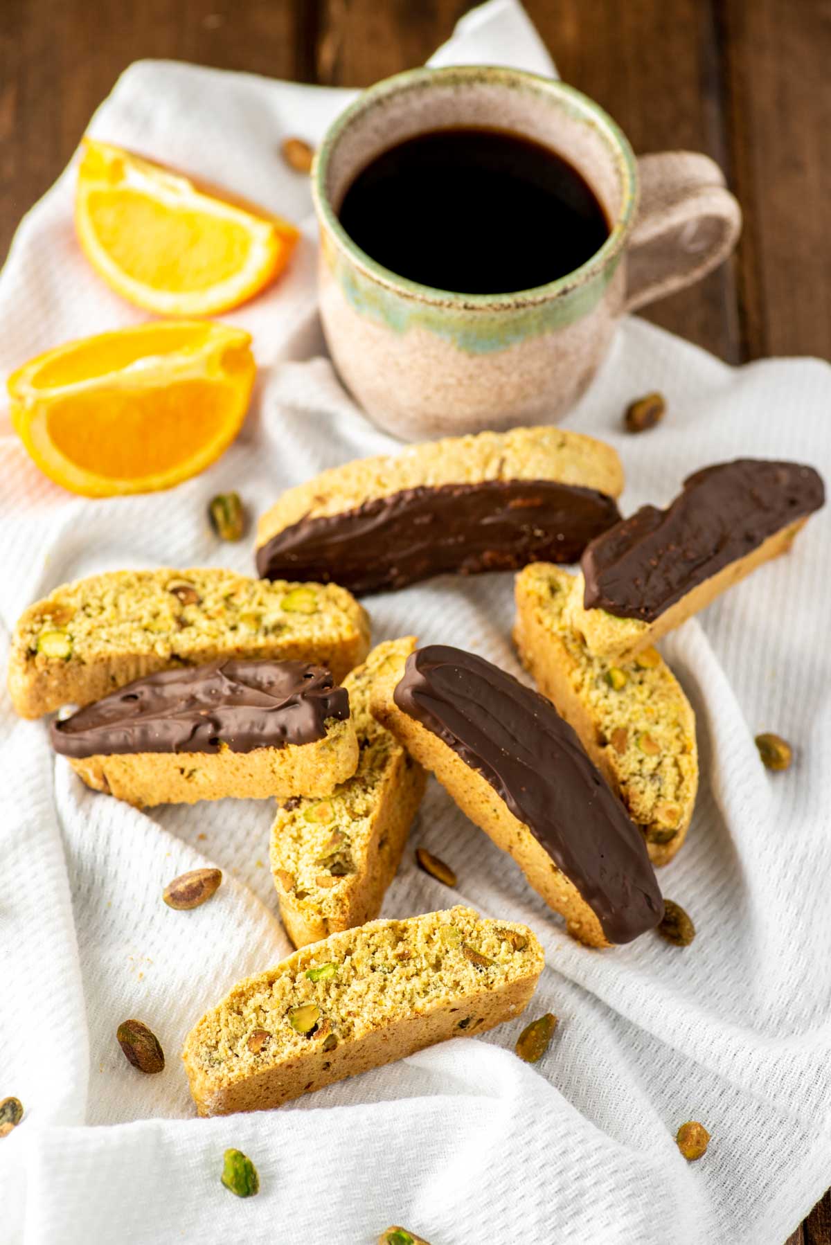 orange pistachio biscotti with cup of coffee