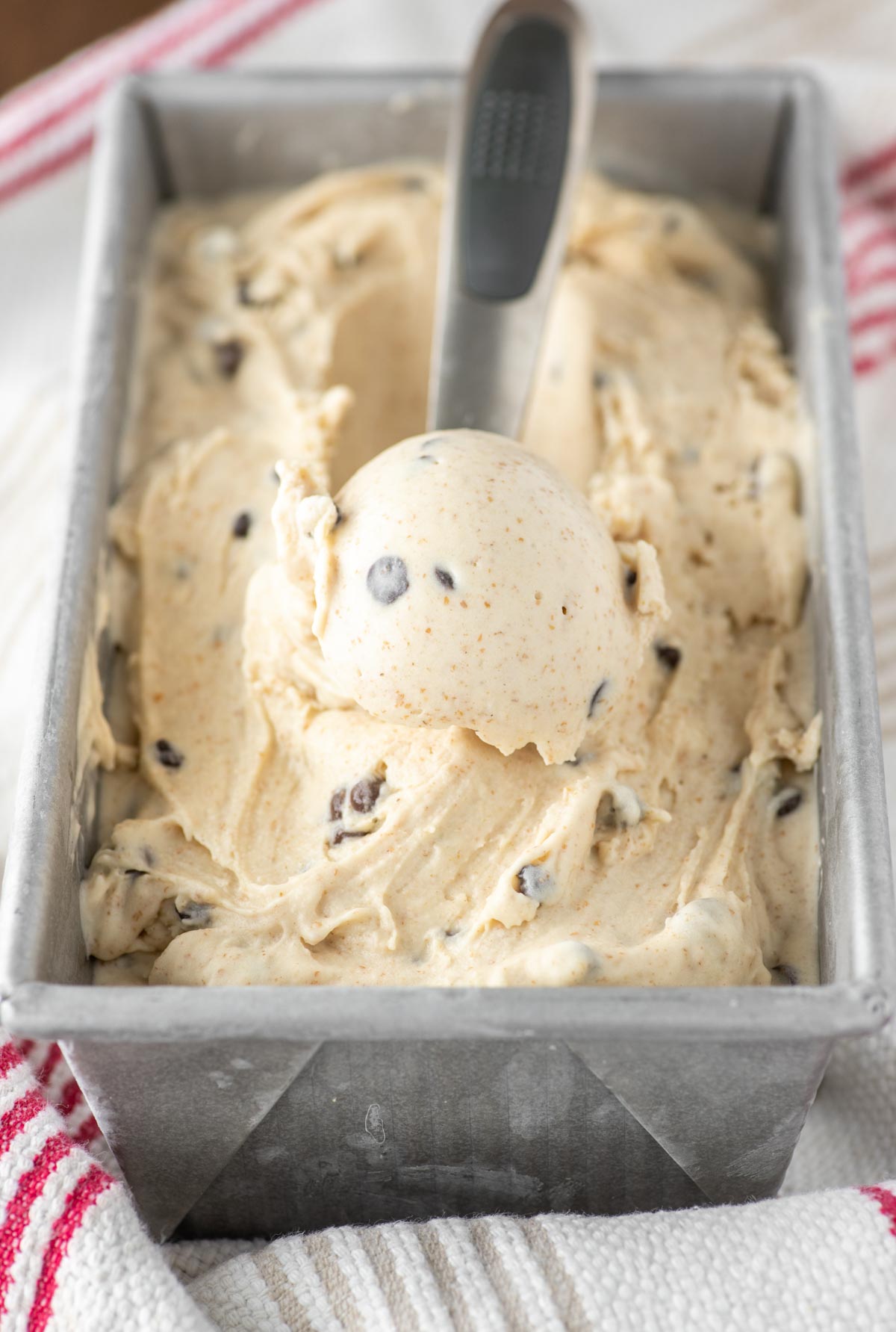 graham cracker ice cream being scooped out of metal pan