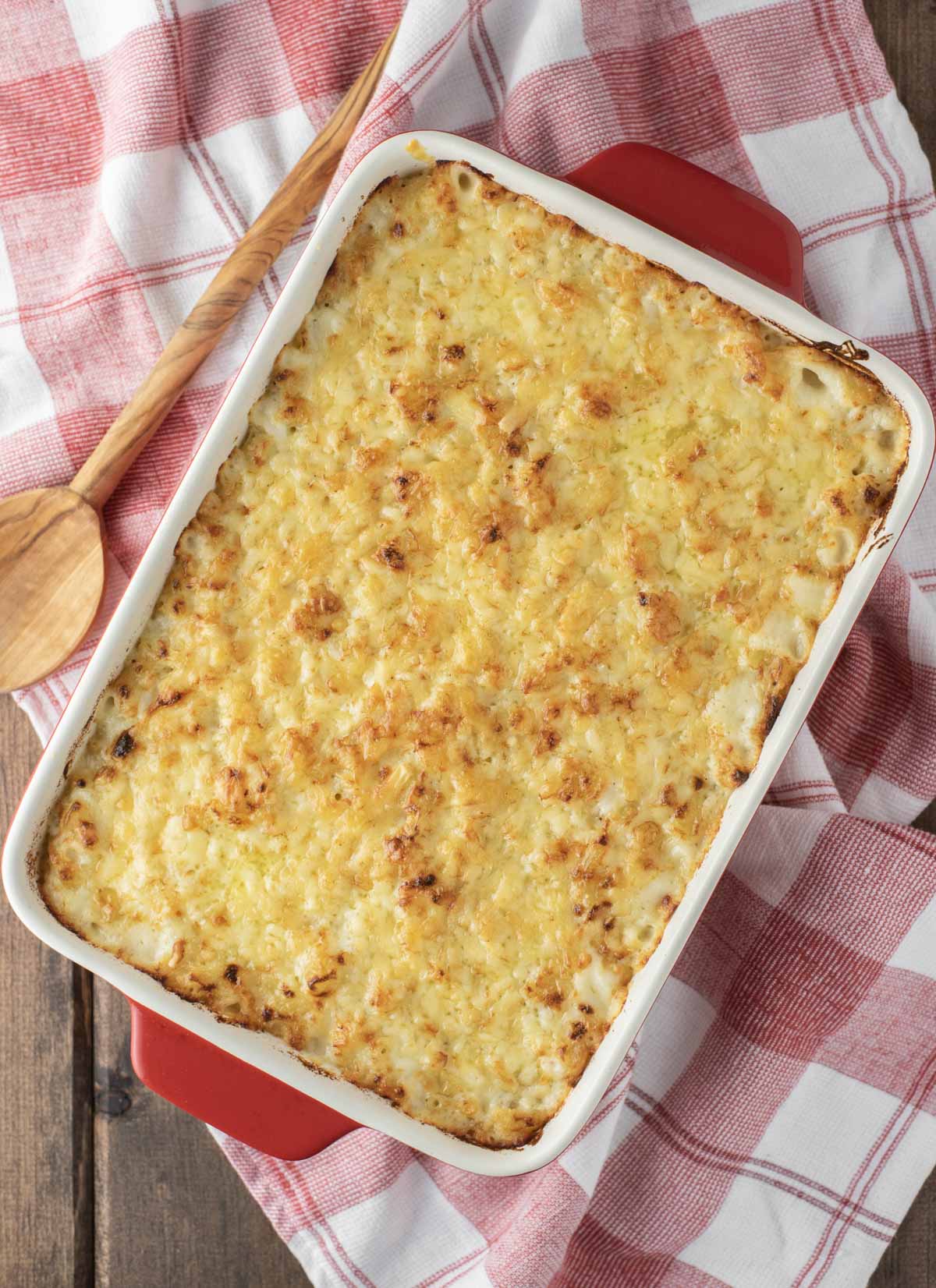 overhead shot of three cheese mac and cheese in red baking pan