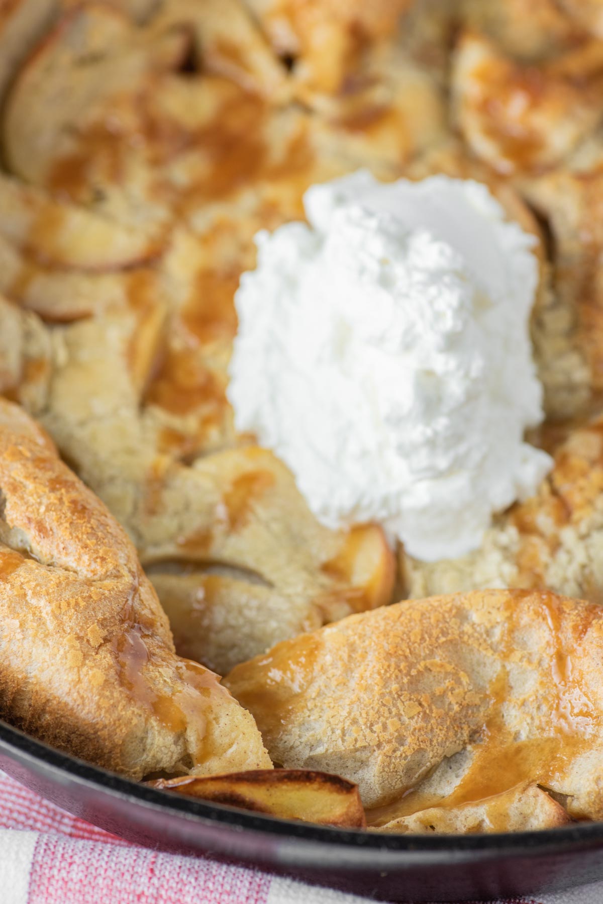 apple dutch baby with whipped cream