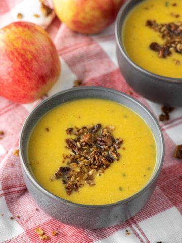 two bowls of butternut squash apple soup