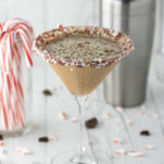 chocolate peppermint martini in glass with cocktail shaker in background